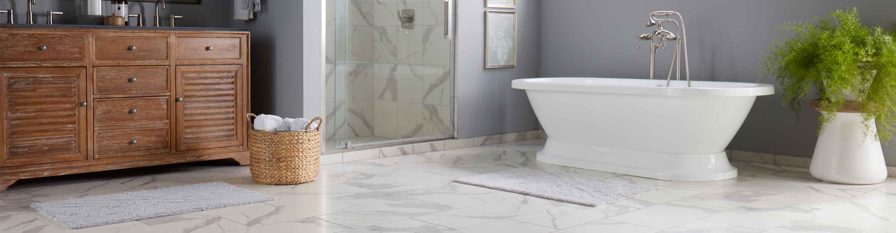 Marble tile floors and shower walls in a bathroom